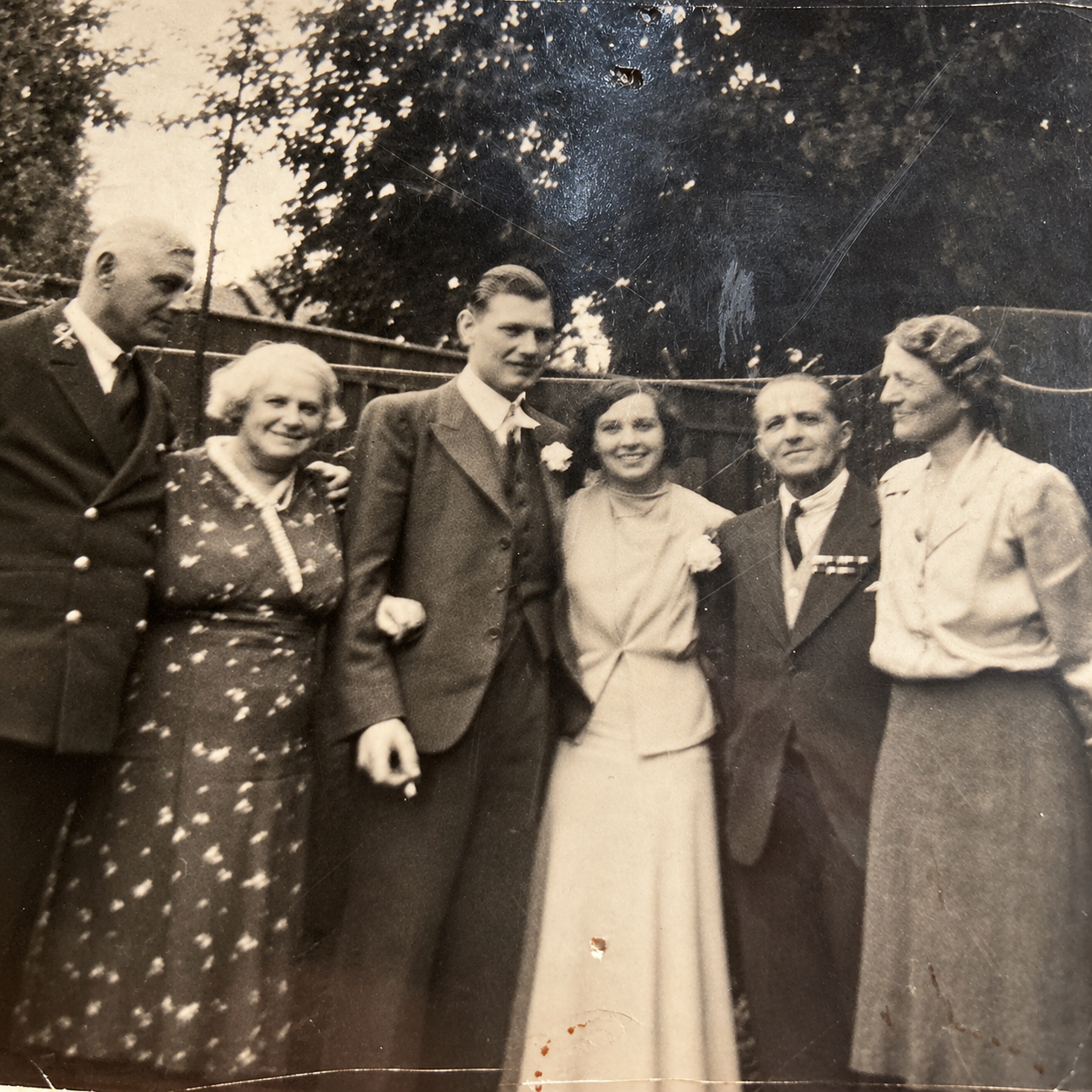 A vintage black and white wedding group portrait of a family